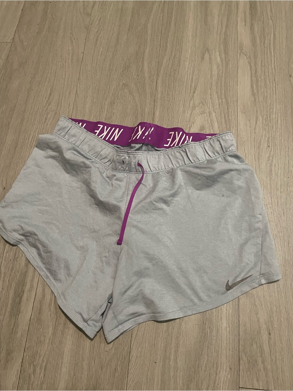 Nike Women's Light Gray Athletic Shorts with Purple Waistband and Drawcord
